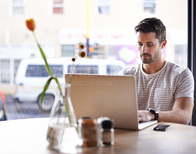 Buy stock photo Coffee shop, working and serious man with laptop and code work in a cafe. Tech, email and male freelancer customer at a restaurant table with online pc and computer writing with focus on web coding
