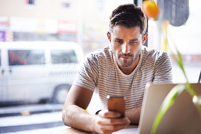 Buy stock photo Phone, laptop or man in cafe reading news on social media for an update on the stock market for trading. Coffee shop, entrepreneur or trader texting on mobile app or networking on internet or website
