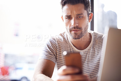 Buy stock photo Man, coffee shop and freelancer phone or laptop, communication and website for information. Male person, bistro and app for conversation, social media and remote work in restaurant for research