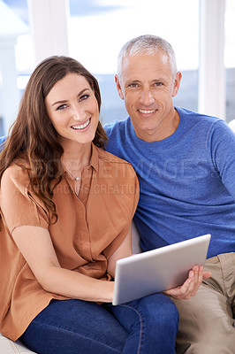 Buy stock photo Couple, tablet and portrait on couch in home with smile, search and app to watch movie with bonding. People, woman and mature man on digital touchscreen to relax in lounge with connection in house