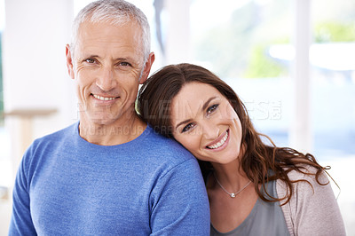 Buy stock photo Couple, portrait and happy in home for love with support, trust and comfort in living room of house. Senior man, woman and smile with face for embrace, affection and healthy relationship in apartment
