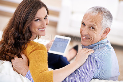Buy stock photo Couple, portrait and smile with tablet on sofa with hug for bonding, screen and relax with social media or internet. Senior man, woman or face with digital display for subscription or embrace in home