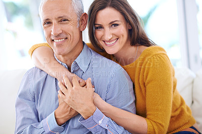 Buy stock photo Happy, couple and hug in portrait, love with unique relationship and support for trust at home. Aged man, young woman and age difference in marriage, commitment and loyalty with pride together