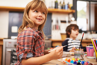 Buy stock photo Little girl, paint and brushing with smile for colorful art, learning or education in creativity at home. Young girl enjoying color, activity or artwork in early childhood development at the house