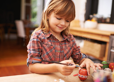Buy stock photo Happy girl, paint and brushing egg with smile for colorful art, learning or education in creativity at home. Young child enjoying color, activity or artwork for early childhood development at house