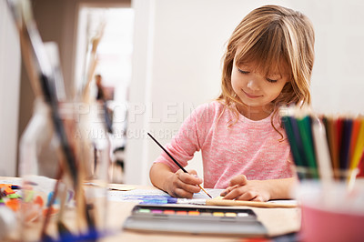 Buy stock photo Happy child, drawing and painting with brush for art, craft or color in learning creativity or education at home. Young girl with paintbrush for sketching, writing or artwork in childhood development
