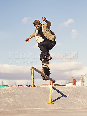 Buy stock photo Energy, fitness and man with skateboard, jump or rail balance at a skate park for stunt training. Freedom, adrenaline and gen z male skater with air, sports or skill practice, exercise or performance