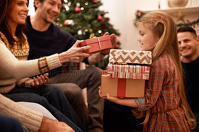 Buy stock photo Shot of a a family giving presents at christmas