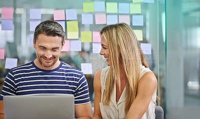 Buy stock photo Two coworkers impressed by their collaboration at work