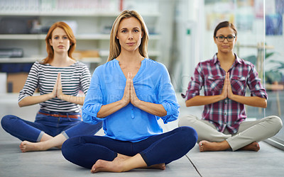 Buy stock photo Group of attractive females doing some yoga indoors