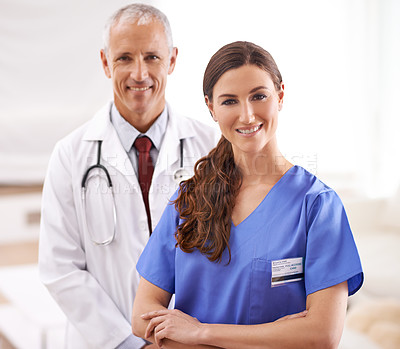 Buy stock photo Doctor, nurse and together in portrait with arms crossed, medical support and wellness in hospital. Medic, mature man and woman in team, smile and healthcare services in clinic with pride for career