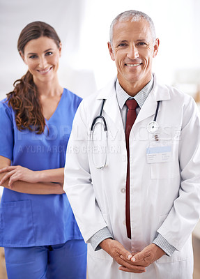 Buy stock photo Doctor, man and nurse in portrait with smile for medical support, wellness and arms crossed in hospital. Medic, surgeon and woman in team, happy and health services in clinic with pride for career