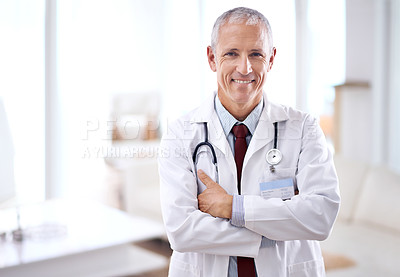 Buy stock photo Portrait of a mature medical doctor smiling at the camera