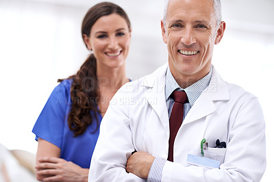 Buy stock photo Doctors, man and woman with smile, arms crossed or portrait for wellness, health or hospital. Mature healthcare expert, nurse and professional with medical knowledge, solidarity or teamwork in clinic