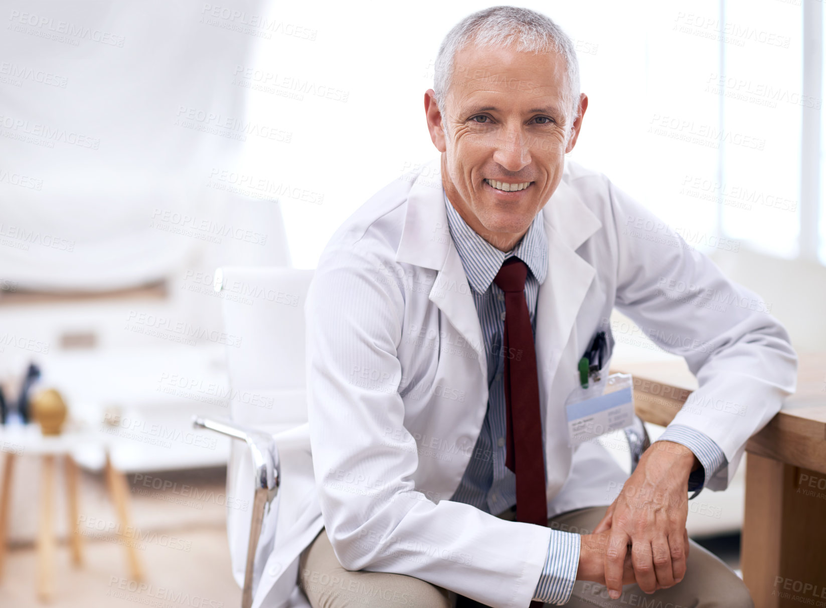 Buy stock photo Portrait, senior doctor and happy man in hospital for healthcare, wellness and working in Australia for career. Smile, medical professional and surgeon, expert and physician in clinic for service