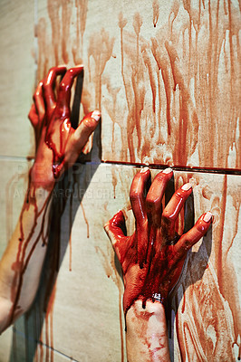 Buy stock photo A cropped shot of a woman's bloody hands on a bathroom wall