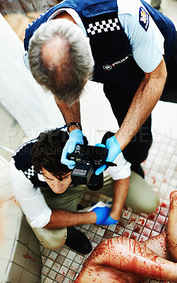 Buy stock photo Shot of investigators working their way through a bloody crime scene