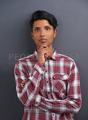 Buy stock photo Portrait, serious and Indian person with designer and gray background at a creative agency office. Hipster, confidence and non binary employee with modern and casual clothing with fashion and style