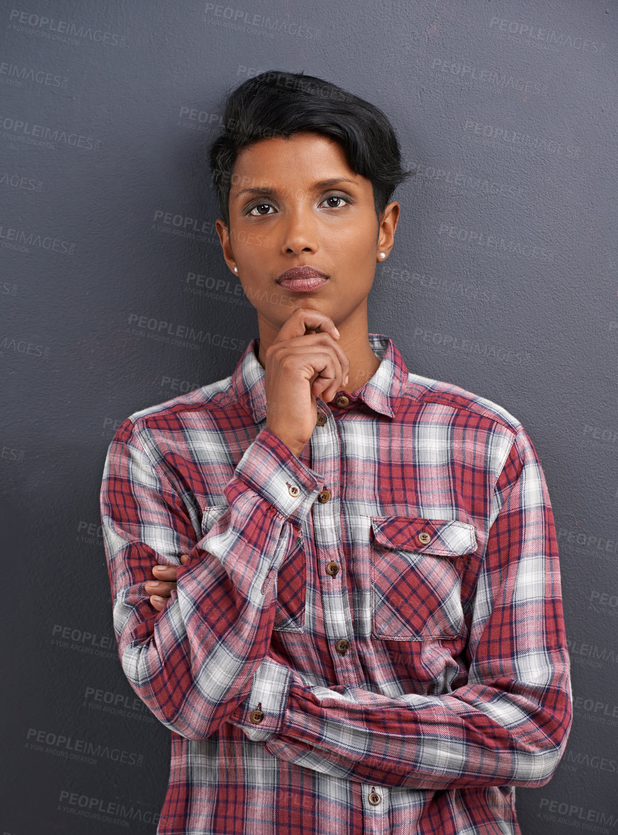 Buy stock photo Portrait, serious and Indian person with designer and gray background at a creative agency office. Hipster, confidence and non binary employee with modern and casual clothing with fashion and style