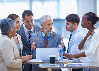 Buy stock photo A cropped shot of a group of businesspeople having a discussion at a meeting