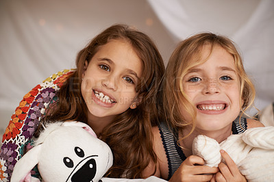 Buy stock photo Happy, sleepover and portrait of kids in bedroom for playing, bonding and relax with toys in home. Excited, friends and young girls on bed in tent or blanket fort for childhood, fun and happiness