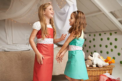 Buy stock photo Fashion, paper and children friends with dress for fun, show or playing together at home. Happy, smile and young girl kids in gift wrap outfit for style with bonding in bedroom at modern house.