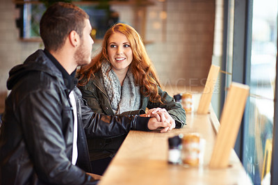 Buy stock photo Couple, smile and holding hands in cafe with love, romance and affection on anniversary date. Romantic, man and woman in restaurant bonding, happy and support in relationship for dating people