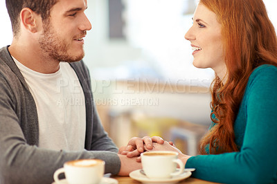 Buy stock photo Couple, bonding and touch of hands in cafe, support and happiness for peace in relationship. Adult, woman and girl with man or partner with hand in coffee shop, smile and joy for marriage with guy