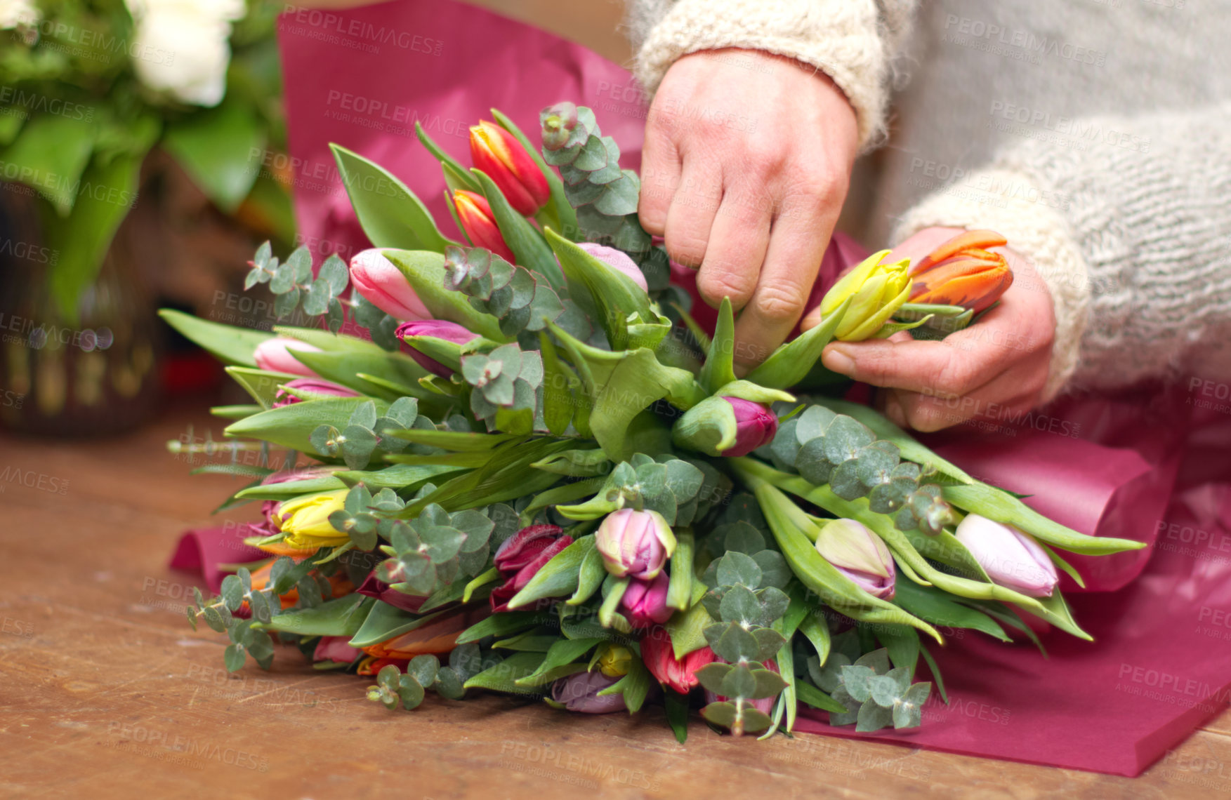 Buy stock photo Cropped shot of a woman preparing a bouquet