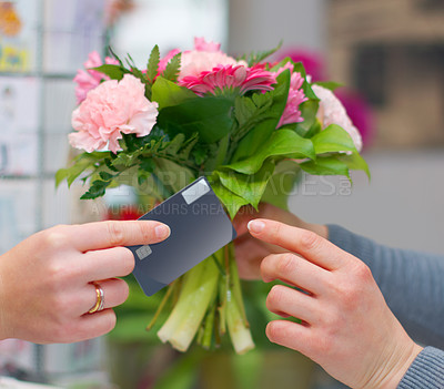 Buy stock photo Hands, flowers and credit card for shopping in florist shop, small business or store for purchase. Plastic money, floral bouquet and customer paying, buying or payment for sale of natural plants.