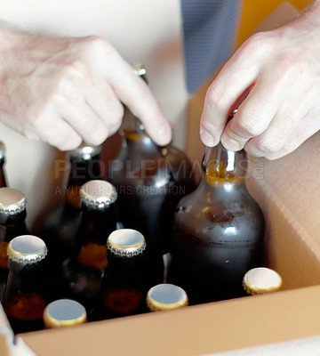 Buy stock photo Shot of bottled beer being boxed for distribution