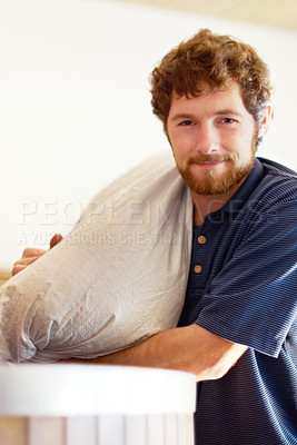 Buy stock photo Brewery, portrait and man with a bag for beer production or manufacturing in a industrial factory. Proud, industry and male brewer or worker brewing lager with ingredients in a alcohol distillery.