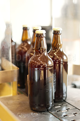 Buy stock photo Production line, beer and bottles in factory, brewery or manufacturing plant. Alcohol glass, conveyor machine and automation of product in warehouse for industrial process in alcoholic industry.