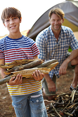 Buy stock photo Boy, father and camping with wood in portrait for heat, cooking and learning on outdoor adventure. Child, papa and  collecting firewood in forest, vacation and happy in nature by tent in Colorado