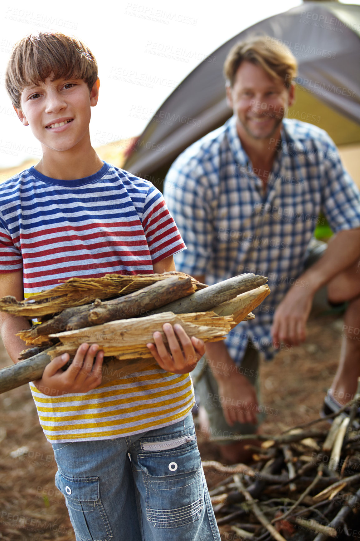 Buy stock photo Boy, father and camping with wood in portrait for heat, cooking and learning on outdoor adventure. Child, papa and  collecting firewood in forest, vacation and happy in nature by tent in Colorado