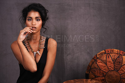 Buy stock photo Indian woman, confident and fashion in studio with jewelry  on grey background with beauty and style. Portrait, female person and makeup with traditional necklaces, outfit and heritage look. 