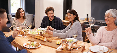 Buy stock photo Bonding, eating and family at dinner in dining room for party, celebration or event at modern home. Smile, happy and group of people enjoying meal, supper or lunch together with wine at house.