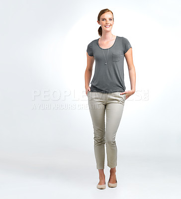 Buy stock photo Portrait of an attractive young woman standing in a studio