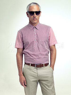 Buy stock photo Confident, businessman or serious in fashion, business or stylish as outfit, apparel or eyewear. Mature man, hand in pocket or sunglasses as smart, casual or clothing in studio on white background