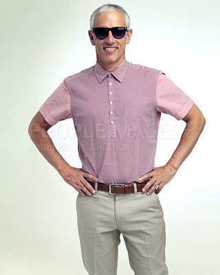 Buy stock photo Confident, happy or businessman in leisure, fashion or stylish look as smart, casual or clothing. Hands on hips, man or smile in sunglasses as trendy outfit or apparel in studio on white background