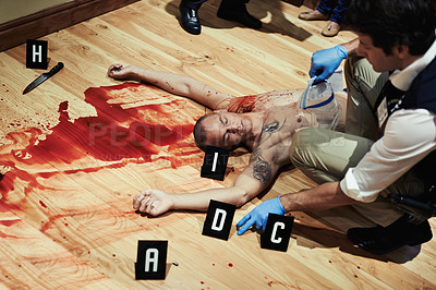 Buy stock photo Shot of an investigator attending a bloody crime scene