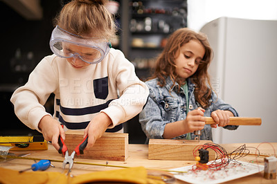 Buy stock photo Play, game and girls with construction, education and learning with fun or safety glasses with hobby or creative. Child development, friends or kids with tools or bonding together with pliers or wood