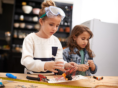 Buy stock photo Child, play and tools for robotics, construction and design for busy and bonding for childhood game. Kids or friend for sibling with wire and tape for crafts, diy or fun indoor for  tasks and cute