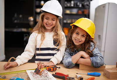 Buy stock photo Children, construction and portrait in workshop with tools, play and game in kitchen of home. Girls, hardhat and protection for wood project on weekend, carpentry and woodworking or manufacture
