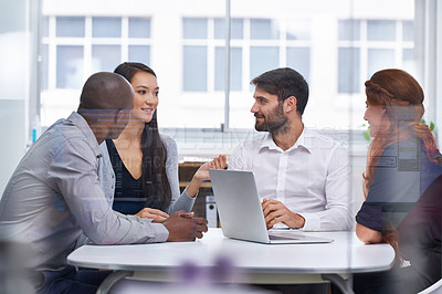 Buy stock photo A group of businesspeople having a meeting in a boardroom at work