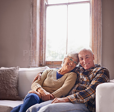 Buy stock photo Elderly couple, smile and portrait on sofa for family, retired and relax for break or rest on mockup. Pensioners and hugging with happiness for embrace, love and comfort on couch in house for unwind