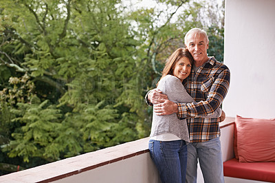 Buy stock photo Senior couple, hug and portrait on balcony with happy, love and outdoor with connection for retirement. Woman, elderly man and embrace on patio with pride, care and smile at apartment in Germany