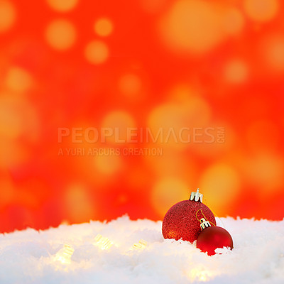 Buy stock photo Christmas, lights and balls for decoration on snow with mockup space in winter on a red background. Xmas, ice and festive sphere, bauble and ornaments for christian holiday celebration at a party