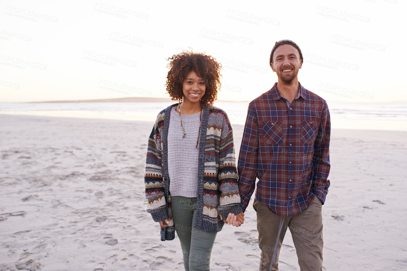 Buy stock photo Couple, beach and walking together holding hands, happy calm people on vacation. Ocean, outdoor and partners in love with respect and care, date and romantic stroll for relax with seaside sunrise
