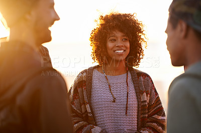 Buy stock photo Sunset, beach and happy friends in nature with conversation, travel or bonding outdoor. Sunrise, adventure and gen z group of people at sea with support, trust or communication on Hawaii vacation